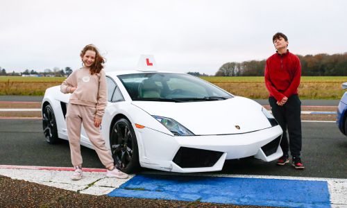 kids stood in front of a Lamborghini